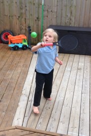 Tennis balls hanging from the washing line